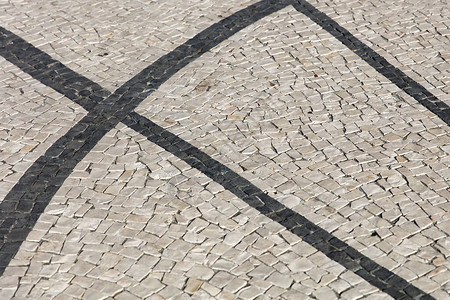 块状花纹旧石板路面的特写表面图片