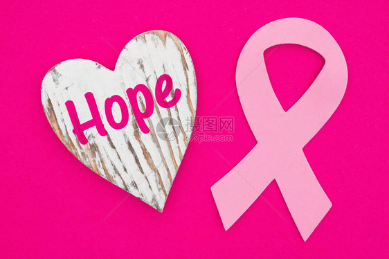 希望用粉红色的癌症丝带传递有关心臟病情的信息明亮粉红图片