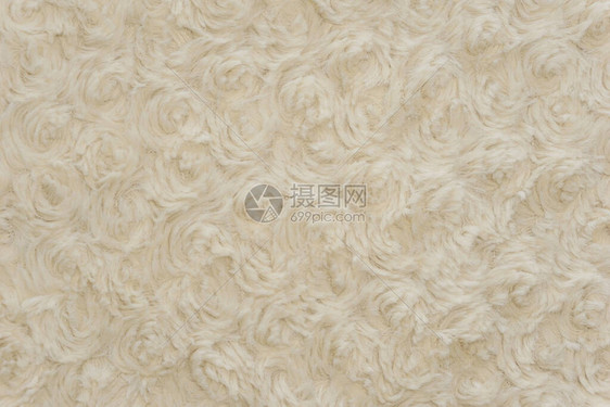 白色羊毛质地背景棉毛白色天然羊毛米色蓬松毛皮碎片白色地毯带编织图案细节的特写轻质羊毛带有扭曲的图片