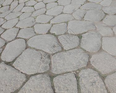 意大利古老罗马人道路的古石块背图片