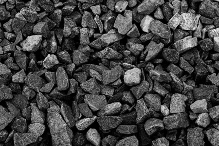 黑色小路石背景深色砾石鹅卵石纹理花图片