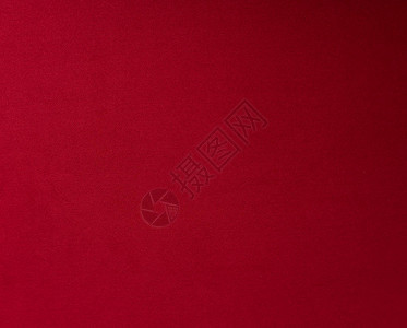背景的红色天鹅绒纹理织物图片