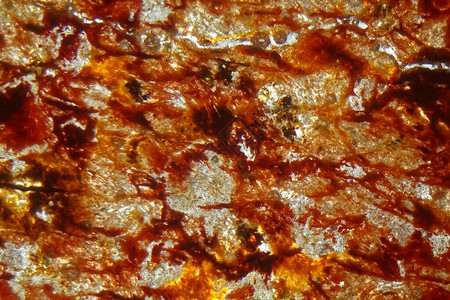 富含铁的红色土表面薄片背景图片