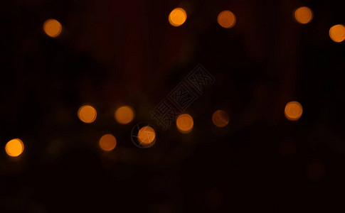 夜晚抽象背景中的灯光散景图片