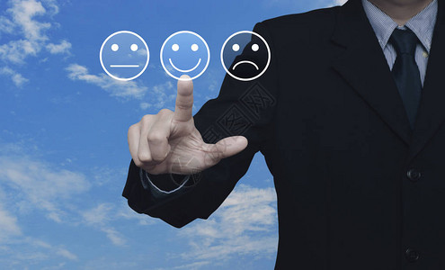 商人在上按优秀的笑脸评级图标商业客户服务评估和图片