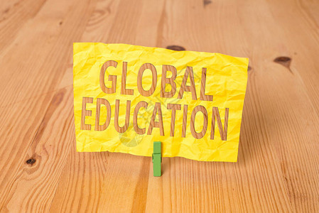 概念手写显示全球教育概念意义跨学科方法必要的概念木地板背景绿色衣图片