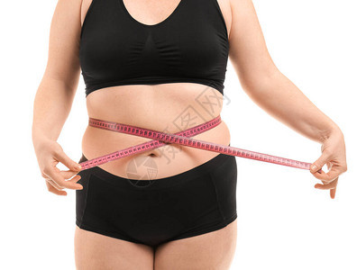 体重超妇女用白色背景的测量磁带图片