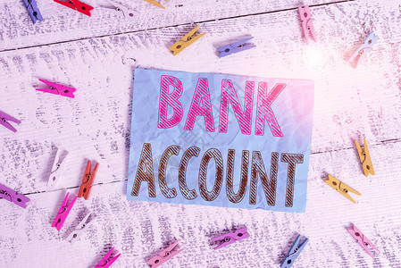 显示银行帐户的书写笔记代表客户委托给银行的资金的商业概念彩色衣夹矩形方图片