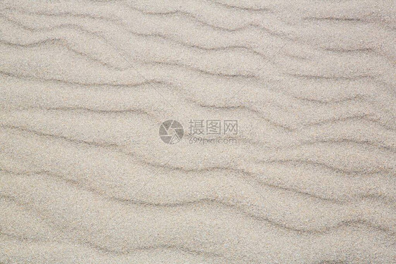 沙子和波浪的抽象背景图片