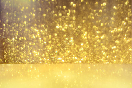 金色闪亮灯光纹理模糊的抽象背景为生日周年婚礼新年前夕或圣诞图片