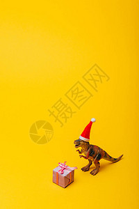 在圣塔帽的玩具恐龙礼物图片