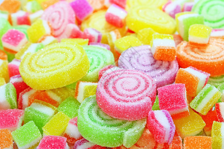 背景由五颜六色的糖果制成背景图片