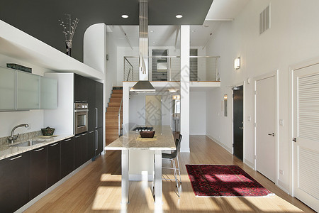 带花岗岩岛的公寓的现代厨房图片