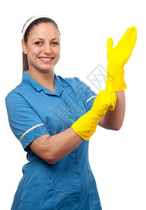 微笑的清洁女工穿上白色隔开的橡胶手套图片