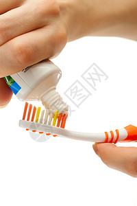 牙刷和牙膏在女手中图片