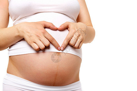 孕妇腹部和心脏由手指构图片