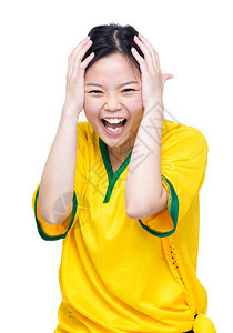 令人兴奋的亚洲女足球支持者在白种图片