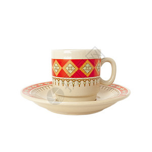 咖啡杯和粘土的茶碟带有族裔特征图片