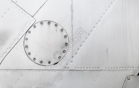 白银金属背景金属纹理和螺栓旧平面的层图片