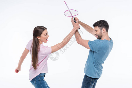 一对夫妇与羽毛球拍打的肖像图片