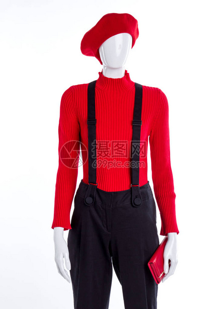 红色贝雷帽毛衣和钱包穿着带吊裤的女模特儿时装图片