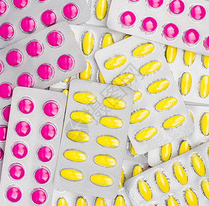 泡罩包装中粉红色和黄色药丸的顶部视图非甾体抗炎药可刺激胃引起胃溃疡用于缓解疼痛经期痉挛头痛图片