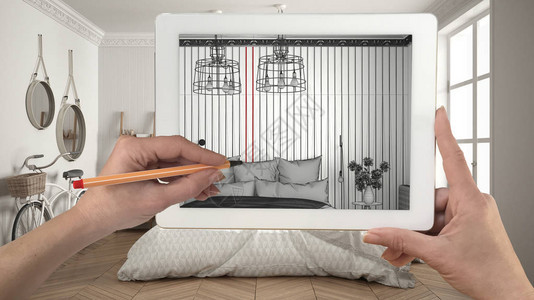 手握和用平板图画显示现代卧室草图图片
