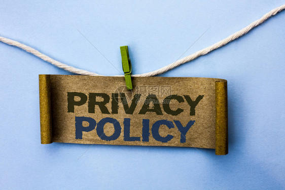 手写文本隐私政策概念意义文档信息安全机密数据保护书面纸板挂在绳索上的图片