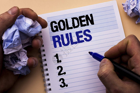 手写文本黄金法则概念意义监管原则核心目的计划规范政策声明由人笔记本书持有标记写图片