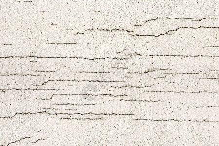 白色肮脏破碎墙的纹理小直径油漆表面的直接骨图片