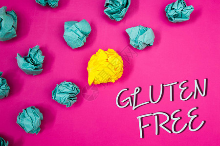 显示GlutenFree的Gluten概念手写商业照片展示饮食与不含小麦等成分的产品如粉色背景图片
