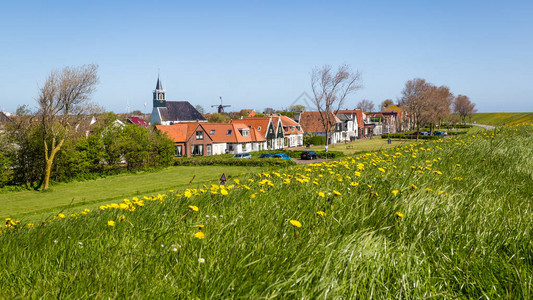 荷兰Wadden岛Texel的马提纳斯教堂风车和长途古老房屋的全景村Oude图片