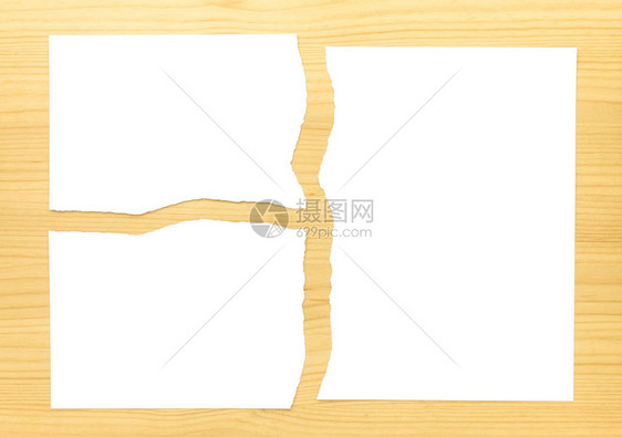 白色撕纸3部分在木背景上白色撕纸部分图片