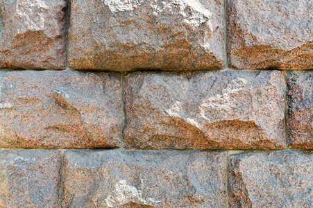 质地由巨大的坚固坚固凸起凸面天然石材弯曲墙壁的花岗岩制成图片
