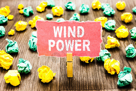 文字书写文本风力使用气流为转动发电机提供机械动力的商业概念Clothespin拿着粉色便条纸皱巴的纸图片