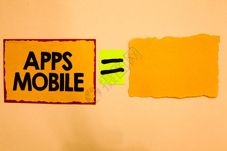 显示AppsMobile的书写笔记商业照片展示旨在手机持设备上运行的计算机程序橙色纸笔记提醒等号重图片