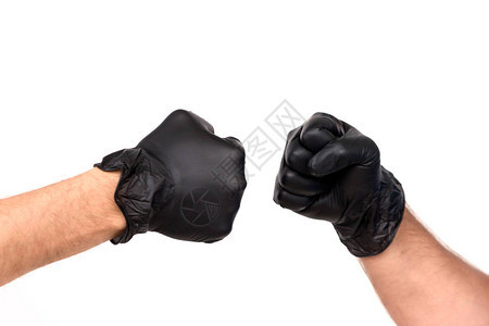 戴着橡胶手套的手紧握成拳头在白色背景上隔离两个专业人士之图片