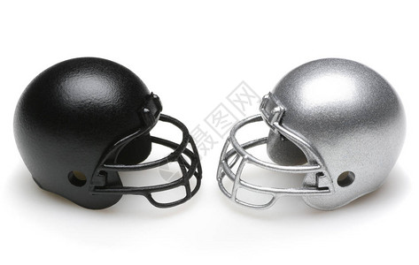 黑色和银色的橄榄球盔甲相互对峙互图片