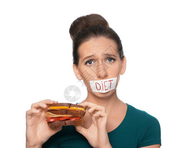 女人用胶带张嘴和美味三明治在图片