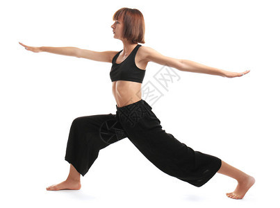 白色背景下练习瑜伽的运动型女图片