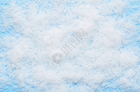 蓝色背景的白毛人造雪背景图片