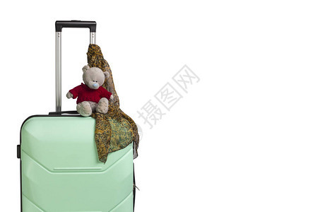塑料旅行箱玩具和围巾白色背景上的把手旅行商务旅行探图片