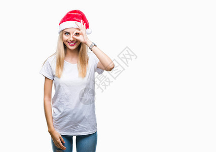 年轻美丽的金发女郎圣诞帽在孤立的背景下做着很好的手势图片