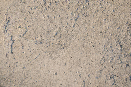 近距离封闭的石灰岩石脸部显示风化层和地质卷纸或背景的图片