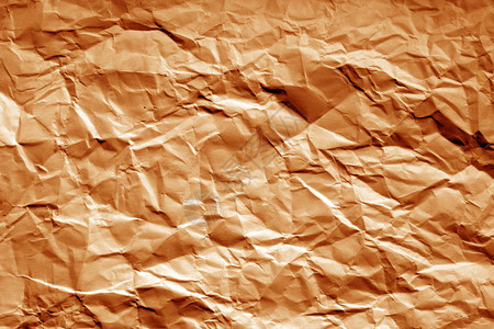 以橙色语调显示模糊效果的碎纸页摘要背图片