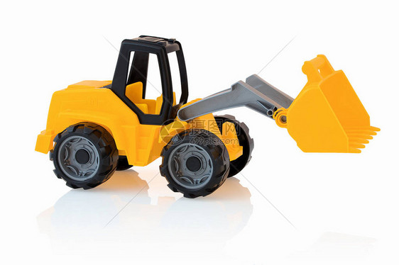 黄色挖掘机与阴影反射隔离在白色背景上白色背景上的塑料儿童玩具施工车辆儿童玩具图片
