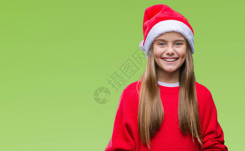 年轻美丽的女孩戴着圣诞帽图片