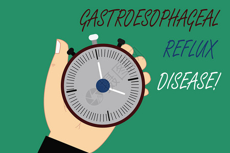 文字书写文本胃食管反流病消化系统疾病燃烧胸痛的商业概念胡分析手持机械秒表计时器与图片