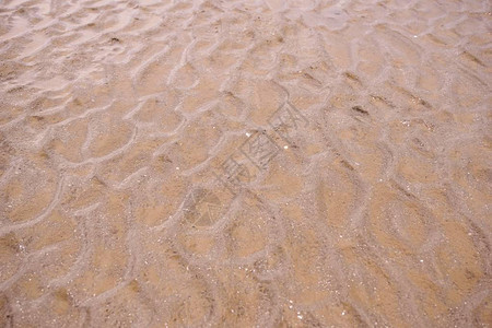 沙滩上的沙子质感背景图片