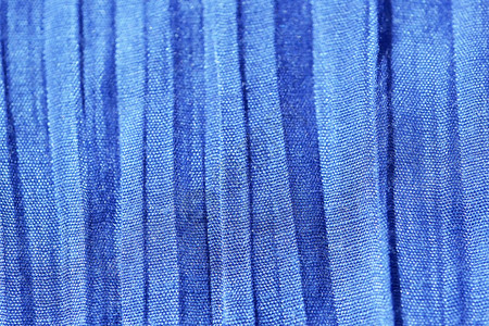 织物编织棉线的蓝色背景特写微距拍摄图片